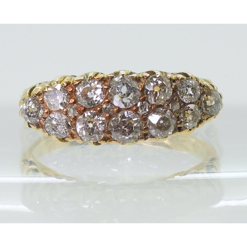 2756 - A DIAMOND CLUSTER RINGin a classic scroll mount, set with estimated approx 0.78cts of old cut diamon... 
