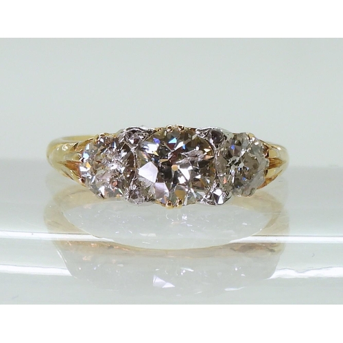 2757 - AN 18CT GOLD THREE STONEset with estimated approx 1.20cts of old cut diamonds, the claws are set wit... 