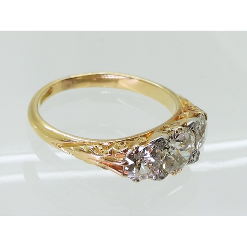 2757 - AN 18CT GOLD THREE STONEset with estimated approx 1.20cts of old cut diamonds, the claws are set wit... 