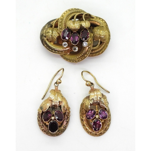 2759 - A GERMAN GEM SET BROOCH & EARRINGSset with foiled back garnets and clear gems, with a botanical ... 