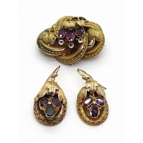 2759 - A GERMAN GEM SET BROOCH & EARRINGSset with foiled back garnets and clear gems, with a botanical ... 