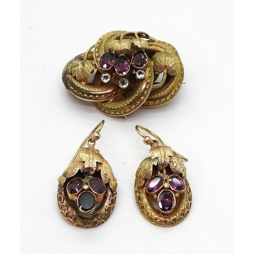 2759 - A GERMAN GEM SET BROOCH & EARRINGSset with foiled back garnets and clear gems, with a botanical ... 