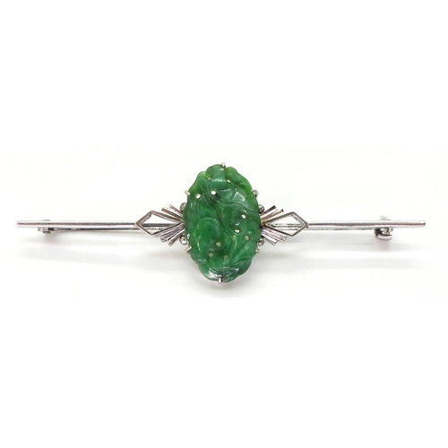 2768 - A CHINESE GREEN HARDSTONE BROOCHin a 9ct white gold Art Deco style mount, the hardstone carved with ... 