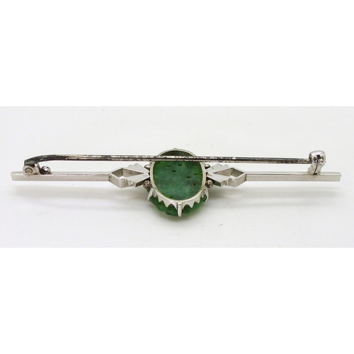 2768 - A CHINESE GREEN HARDSTONE BROOCHin a 9ct white gold Art Deco style mount, the hardstone carved with ... 