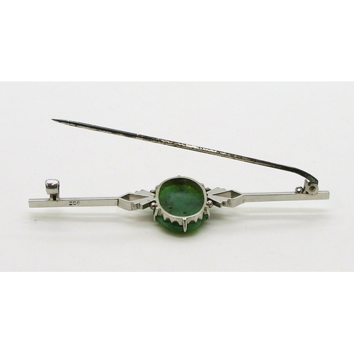 2768 - A CHINESE GREEN HARDSTONE BROOCHin a 9ct white gold Art Deco style mount, the hardstone carved with ... 