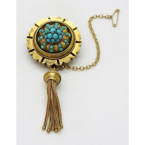 2770 - A VICTORIAN TURQUOISE BROOCHstamped 15ct, with domed locket back and tassel. diameter 3.3cm diameter... 