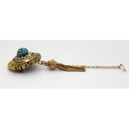 2770 - A VICTORIAN TURQUOISE BROOCHstamped 15ct, with domed locket back and tassel. diameter 3.3cm diameter... 