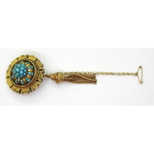 2770 - A VICTORIAN TURQUOISE BROOCHstamped 15ct, with domed locket back and tassel. diameter 3.3cm diameter... 