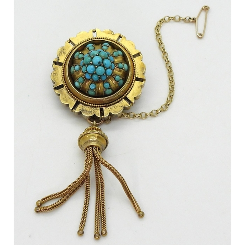 2770 - A VICTORIAN TURQUOISE BROOCHstamped 15ct, with domed locket back and tassel. diameter 3.3cm diameter... 