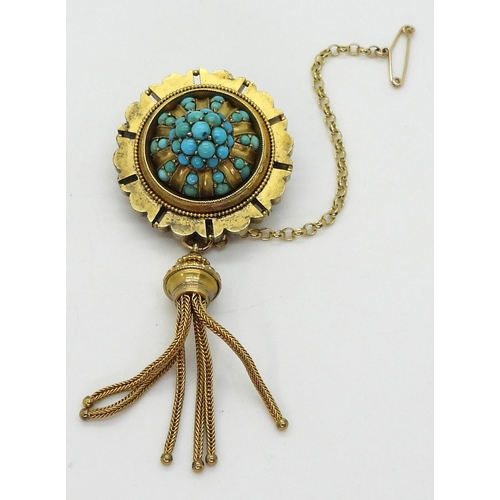 2770 - A VICTORIAN TURQUOISE BROOCHstamped 15ct, with domed locket back and tassel. diameter 3.3cm diameter... 