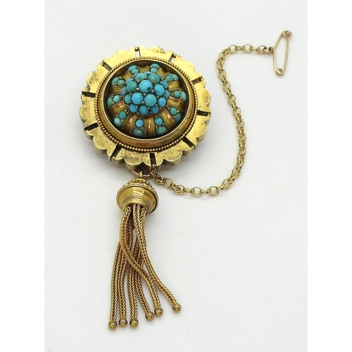 2770 - A VICTORIAN TURQUOISE BROOCHstamped 15ct, with domed locket back and tassel. diameter 3.3cm diameter... 