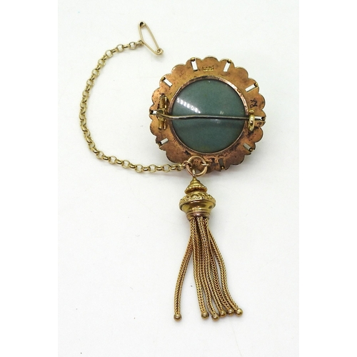 2770 - A VICTORIAN TURQUOISE BROOCHstamped 15ct, with domed locket back and tassel. diameter 3.3cm diameter... 