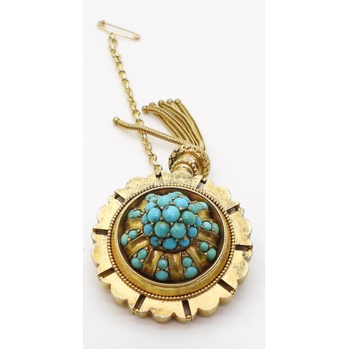 2770 - A VICTORIAN TURQUOISE BROOCHstamped 15ct, with domed locket back and tassel. diameter 3.3cm diameter... 