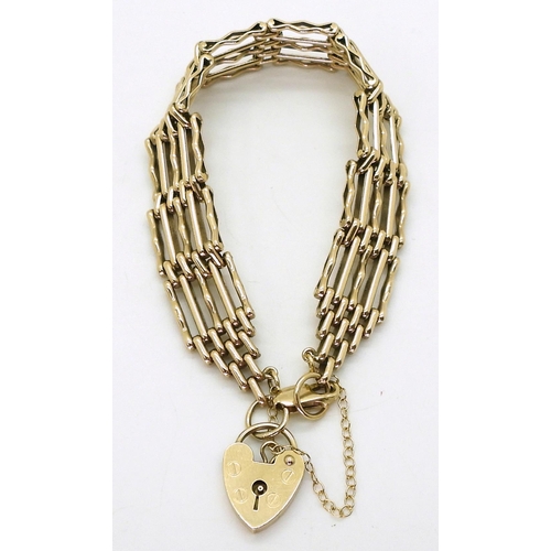 2773 - A 9CT GATE BRACELETthe fancy links measure 1.3cm wide, and have a heart shaped clasp, length 19cm, w... 