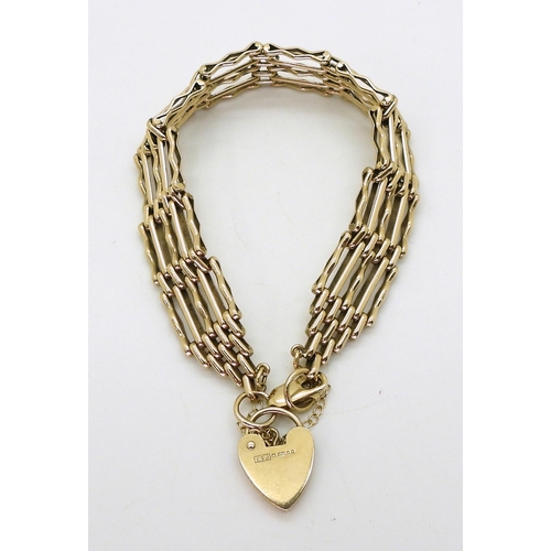 2773 - A 9CT GATE BRACELETthe fancy links measure 1.3cm wide, and have a heart shaped clasp, length 19cm, w... 