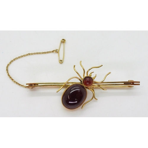 2777 - A SPIDER BROOCHmounted in 9ct gold with garnets the largest approx 14.5mm x 11mm, length of brooch 6... 