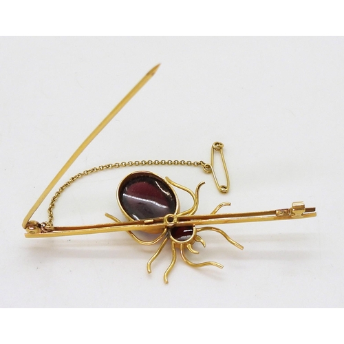 2777 - A SPIDER BROOCHmounted in 9ct gold with garnets the largest approx 14.5mm x 11mm, length of brooch 6... 