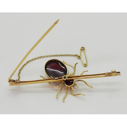 2777 - A SPIDER BROOCHmounted in 9ct gold with garnets the largest approx 14.5mm x 11mm, length of brooch 6... 