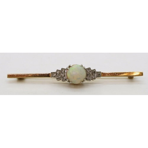 2780 - AN OPAL AND DIAMOND BROOCHset in 18ct yellow gold and platinum, set with a central round opal of app... 