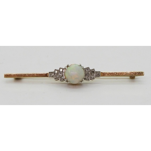 2780 - AN OPAL AND DIAMOND BROOCHset in 18ct yellow gold and platinum, set with a central round opal of app... 