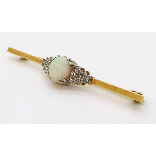 2780 - AN OPAL AND DIAMOND BROOCHset in 18ct yellow gold and platinum, set with a central round opal of app... 