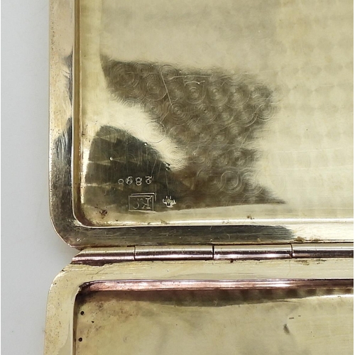 2781 - A CIGARETTE CASEwith all over machine engraving, with hand engraved monogram to the front, the inter... 