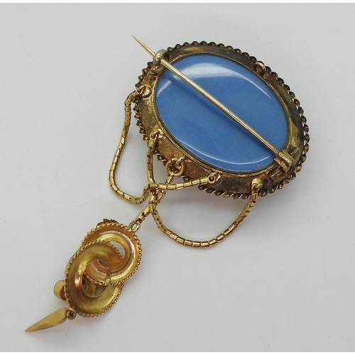 2782 - A VICTORIAN LOCKET BACK BROOCHmade in bright yellow metal, set with foiled back garnets to the centr... 