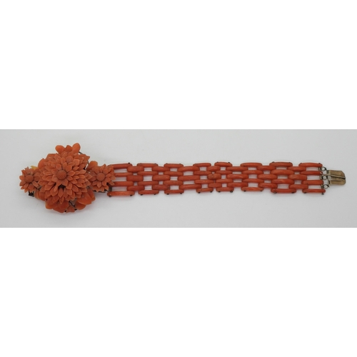 2783 - A VINTAGE CORAL BRACELETwith central flower motif, made from carved coral petals (some losses) with ... 