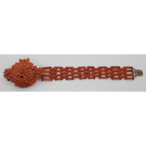 2783 - A VINTAGE CORAL BRACELETwith central flower motif, made from carved coral petals (some losses) with ... 