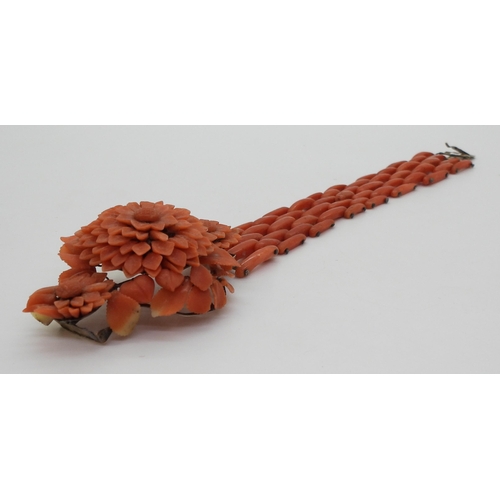 2783 - A VINTAGE CORAL BRACELETwith central flower motif, made from carved coral petals (some losses) with ... 