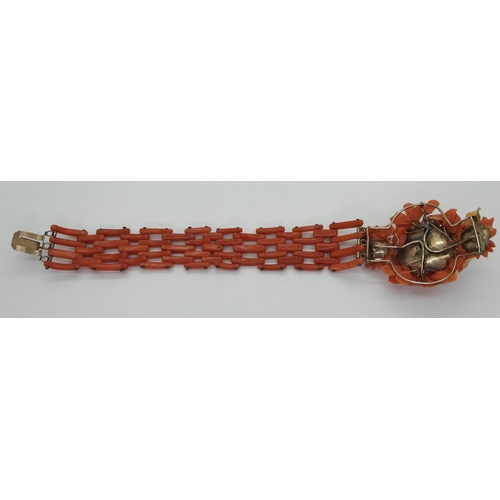 2783 - A VINTAGE CORAL BRACELETwith central flower motif, made from carved coral petals (some losses) with ... 