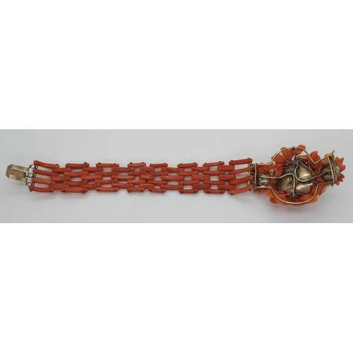 2783 - A VINTAGE CORAL BRACELETwith central flower motif, made from carved coral petals (some losses) with ... 