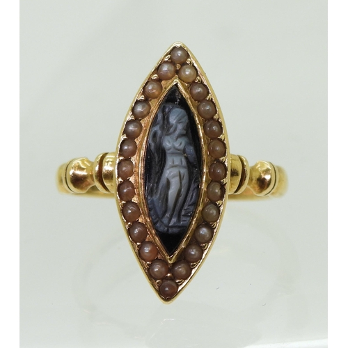 2784 - A MOURNING RINGof marquis shape, made in 18ct gold, set with a black and white gem cameo carved with... 