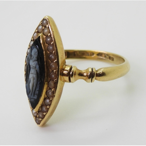 2784 - A MOURNING RINGof marquis shape, made in 18ct gold, set with a black and white gem cameo carved with... 