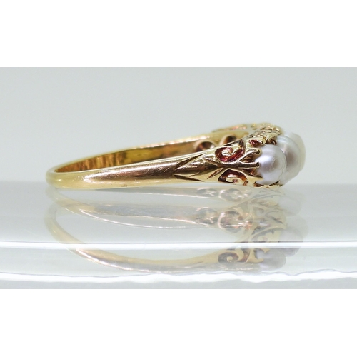 2788 - A FIVE PEARL RINGin classic 18ct gold scroll mount, finger size O1/2, weight 3.9gms... 