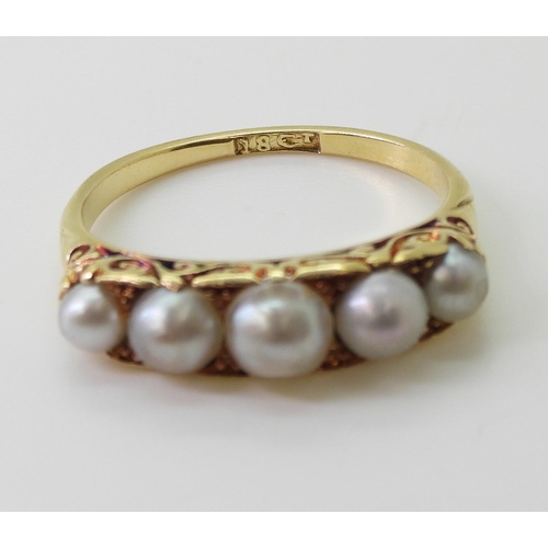 2788 - A FIVE PEARL RINGin classic 18ct gold scroll mount, finger size O1/2, weight 3.9gms... 