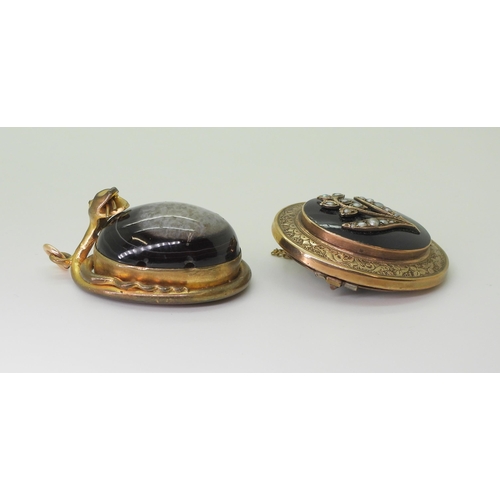 2791 - TWO VICTORIAN JEWELSa yellow metal brooch with a locket back, black enamelled front panel depicting ... 