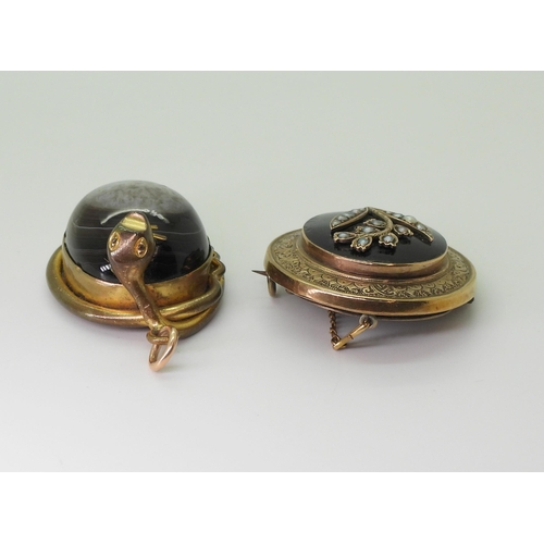 2791 - TWO VICTORIAN JEWELSa yellow metal brooch with a locket back, black enamelled front panel depicting ... 