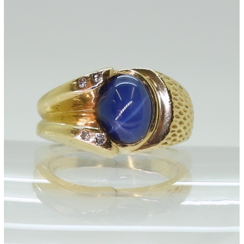 2793 - A 14K GOLD GENTS RINGset with a synthetic star sapphire and diamond accents, finger size R1/2, weigh... 