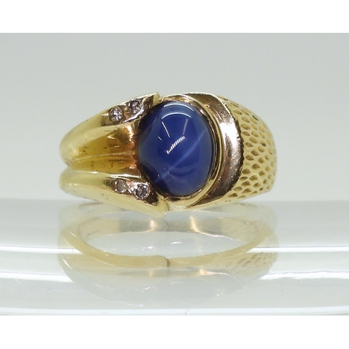 2793 - A 14K GOLD GENTS RINGset with a synthetic star sapphire and diamond accents, finger size R1/2, weigh... 