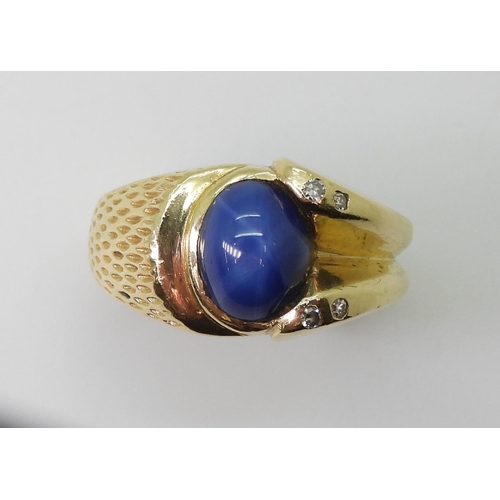 2793 - A 14K GOLD GENTS RINGset with a synthetic star sapphire and diamond accents, finger size R1/2, weigh... 