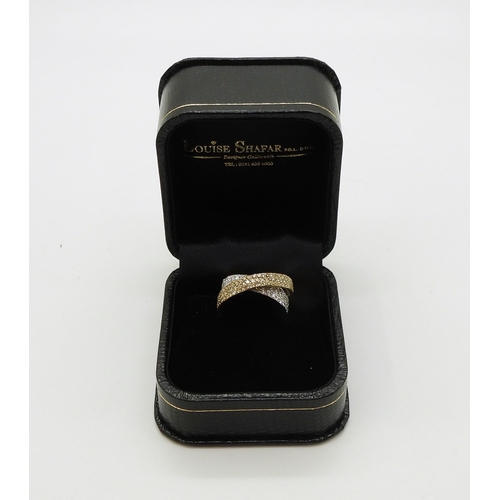 2794 - A STYLISH TWIST DIAMOND RINGmade in 18ct yellow and white gold and set with champagne and white diam... 