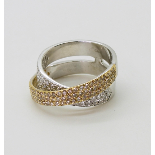 2794 - A STYLISH TWIST DIAMOND RINGmade in 18ct yellow and white gold and set with champagne and white diam... 