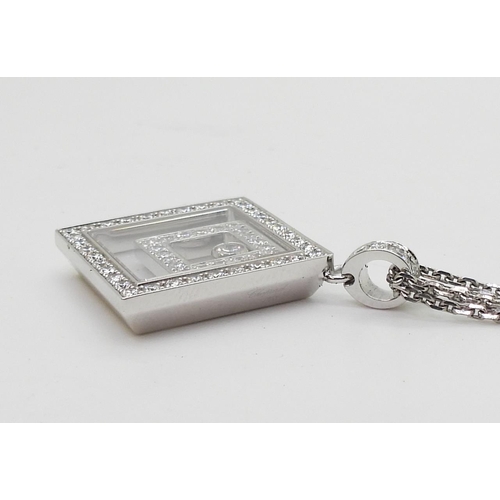 2795 - A CHOPARD HAPPY-SPIRIT PENDANTin 18ct white gold, the square pendant has two diamond set free floati... 