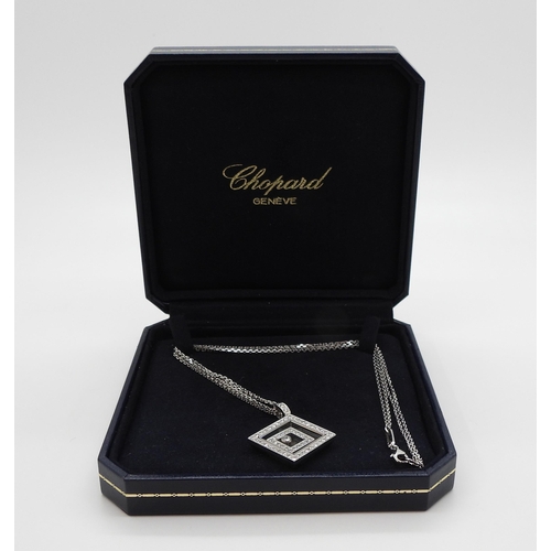 2795 - A CHOPARD HAPPY-SPIRIT PENDANTin 18ct white gold, the square pendant has two diamond set free floati... 