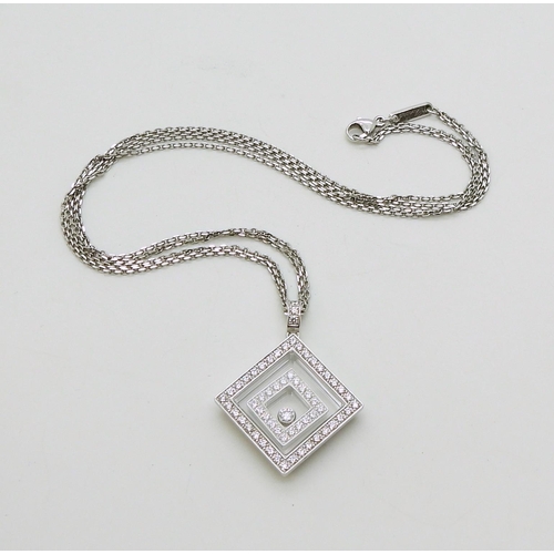 2795 - A CHOPARD HAPPY-SPIRIT PENDANTin 18ct white gold, the square pendant has two diamond set free floati... 