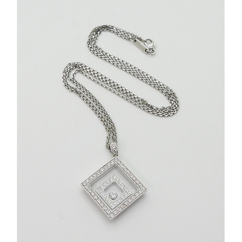 2795 - A CHOPARD HAPPY-SPIRIT PENDANTin 18ct white gold, the square pendant has two diamond set free floati... 