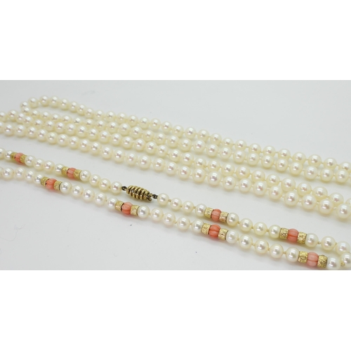 2796 - TWO STRINGS OF PEARLSa string of Mikimoto pearls with coral and 9ct gold bead details, the tongue of... 