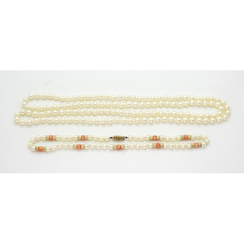 2796 - TWO STRINGS OF PEARLSa string of Mikimoto pearls with coral and 9ct gold bead details, the tongue of... 