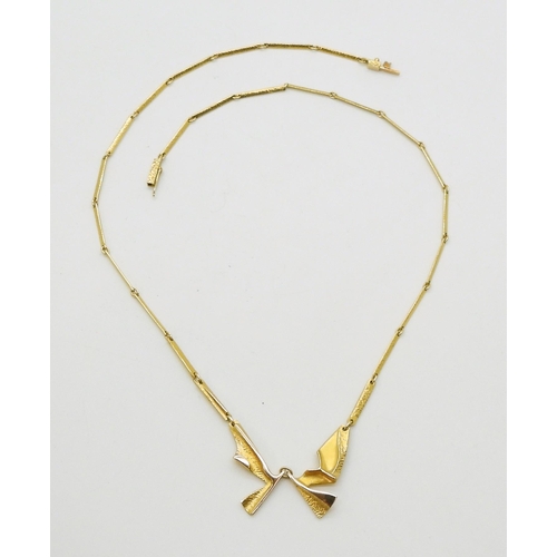 2800 - AN 14CT LAPPONIA NECKLACEan abstract winged form with baton links and box clasp, signed Lapponia wit... 